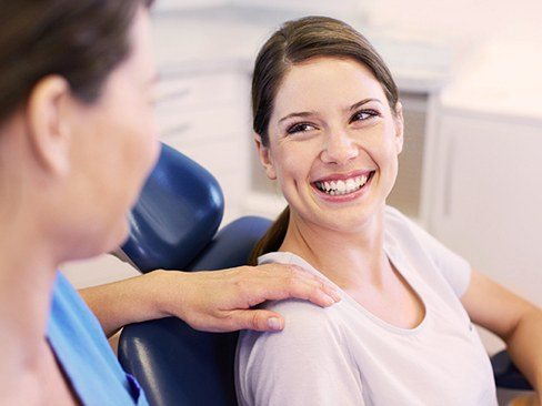 Smiling woman in dental chair