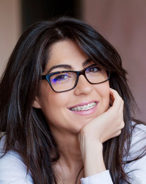 Smiling woman undergoing adult orthodontic care in Dallas