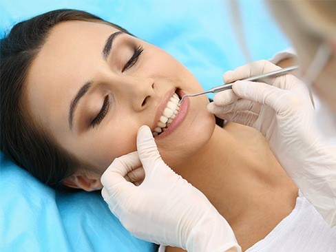 Woman receiving gum disease treatment