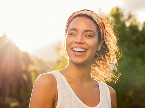 A young woman smiling after braces treatment