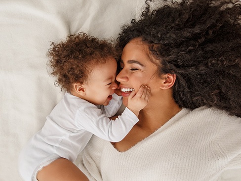 mom nuzzling with infant 