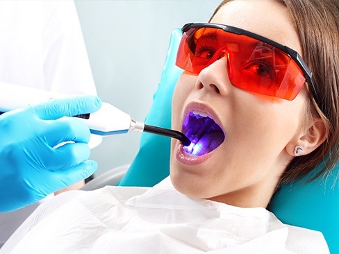 Patient receiving dental sealants