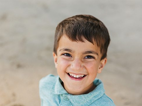 Child receiving exam after tooth colored fillings