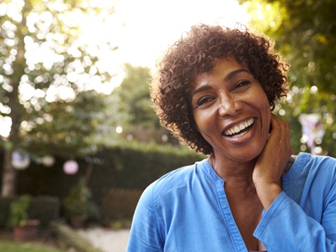 woman smiling outdoors