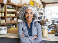 a woman folding her arms with a healthy smile