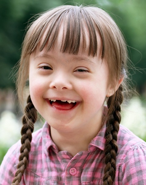 Little girl smiling after receiving special needs dentistry in Dallas