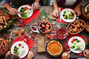 Table spread of holiday foods that can cause cavities in Dallas