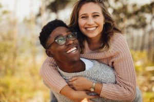 a happy couple showing their beautiful smiles