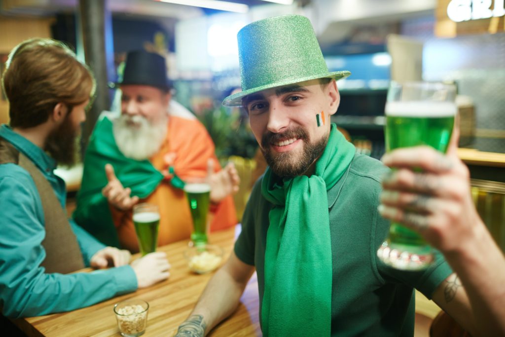 people toasting green beer