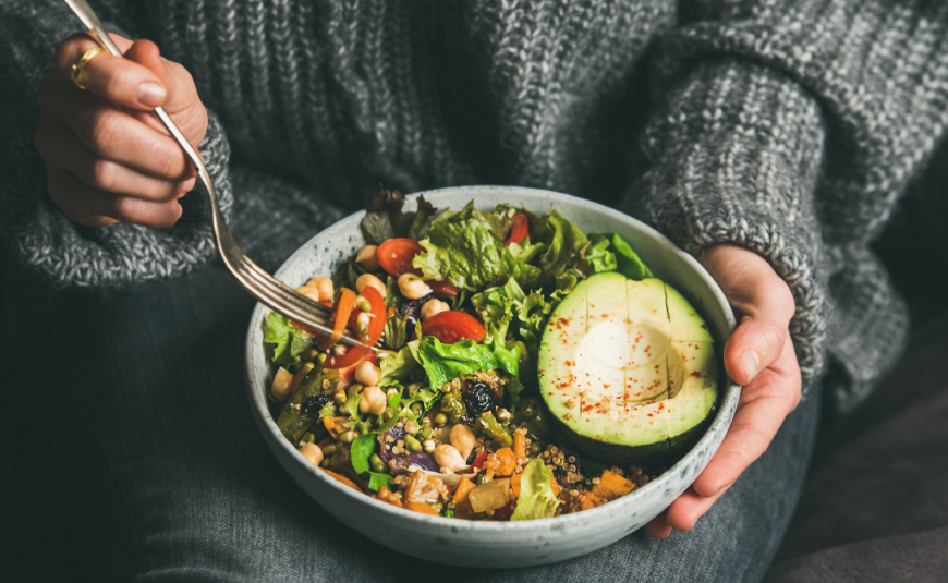 Woman eating salad bowl